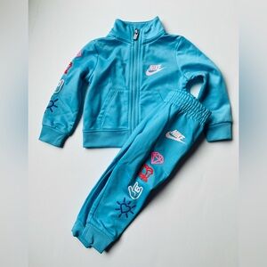 Nike Light Blue Tracksuit with Vibrant Accents